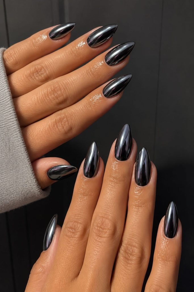 Black mirror nail designs with a reflective chrome finish creating a bold futuristic manicure