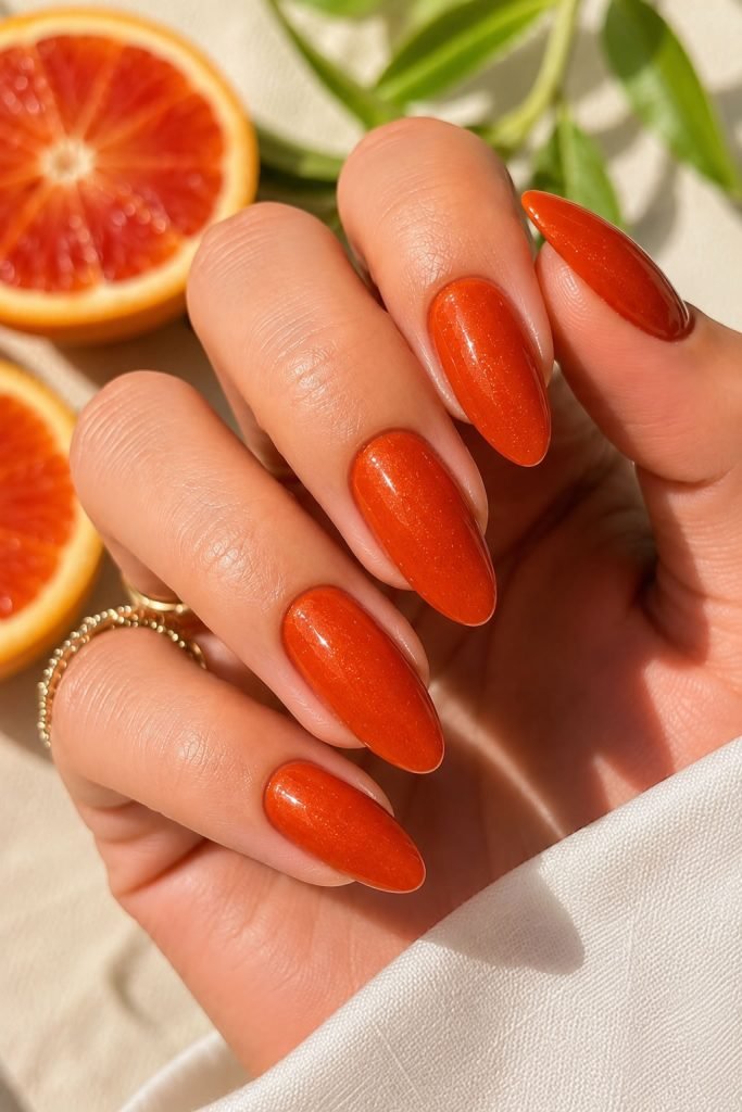 Blood orange summer nails featuring bold orange-red nail colors for sunny days