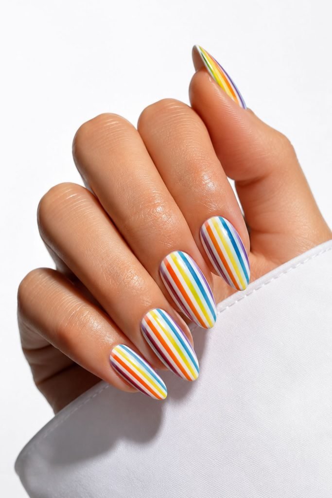 Colorful striped almond manicure with vibrant vertical nail art design