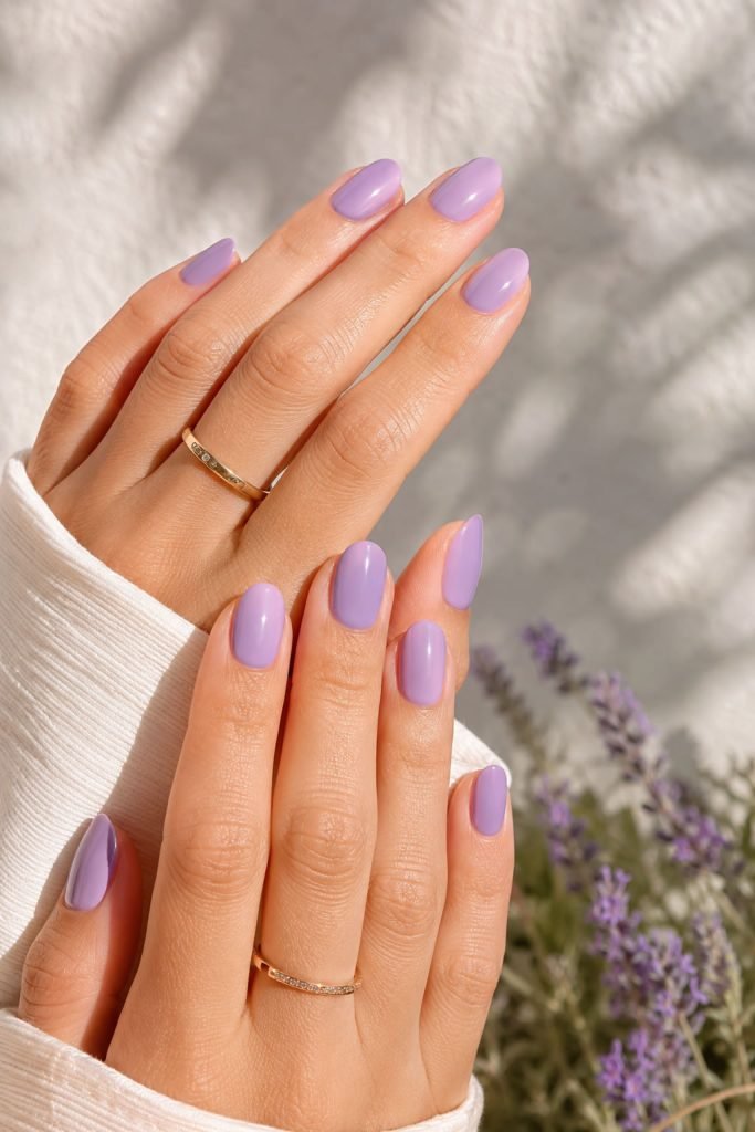 Light purple summer nails with a glossy pastel nail color for a fresh seasonal manicure