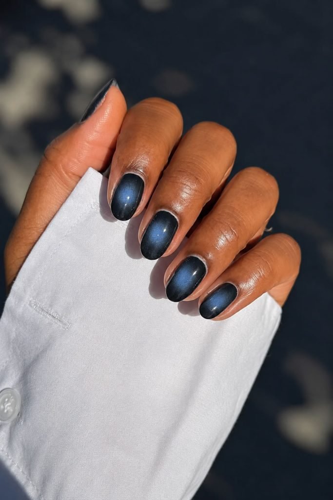 Midnight aura black nails with soft smoky chrome gradient creating a trendy aura manicure