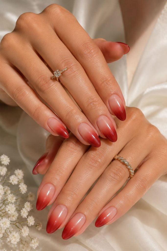 Ombre red almond nail ideas with gradient French tips and glossy finish