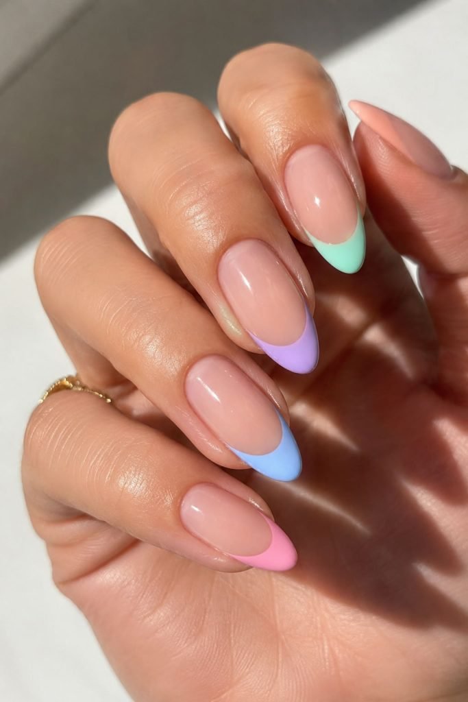 Pastel French tip summer nails featuring trendy nail colors on a nude base