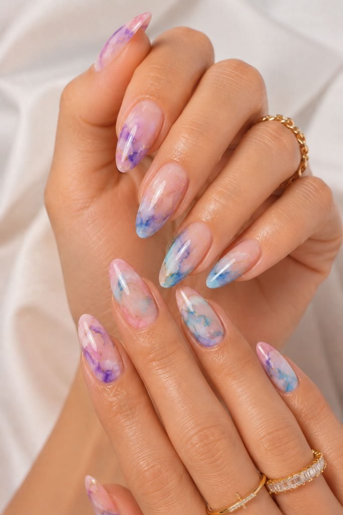 Watercolor almond manicure with dreamy pastel blended nail art design
