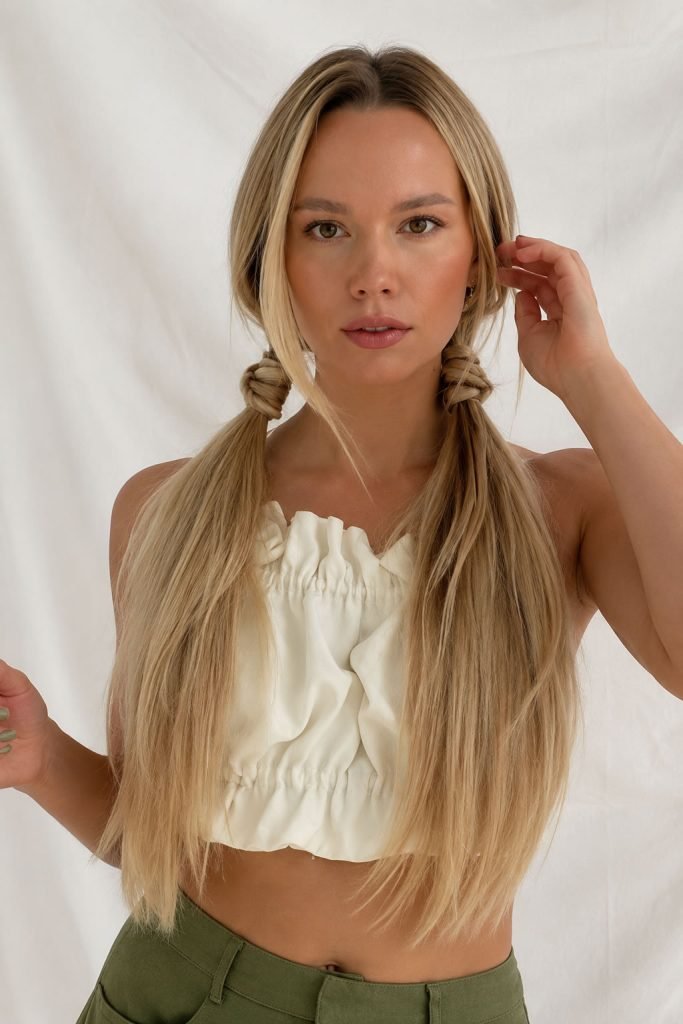 low pigtails with braided base hairstyle