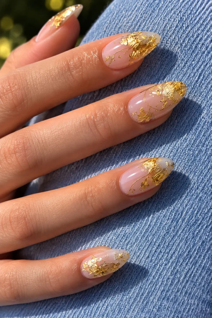 Glittering gold graduation nails with luxurious gold leaf details