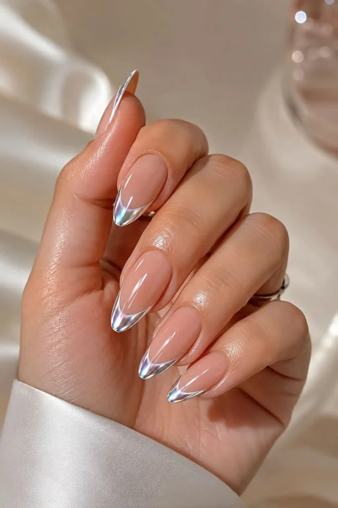 Chrome French tip nails with reflective silver and iridescent accents