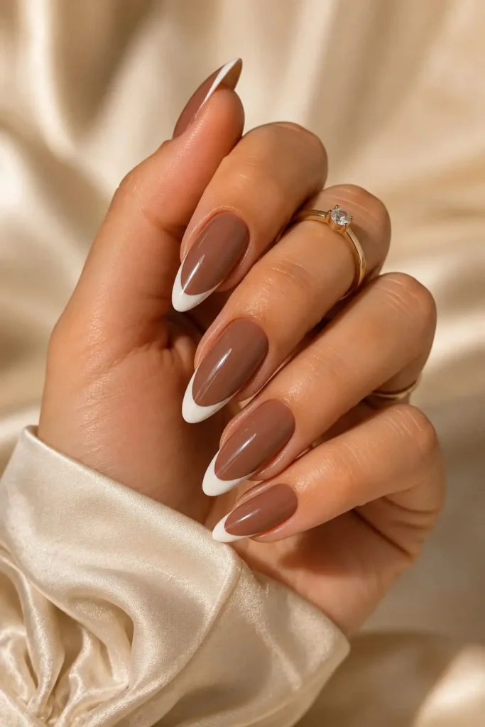 Dark nude brown nails with playful white French tips