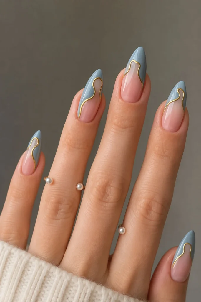 Dusty blue French tip graduation nails with delicate gold wave details