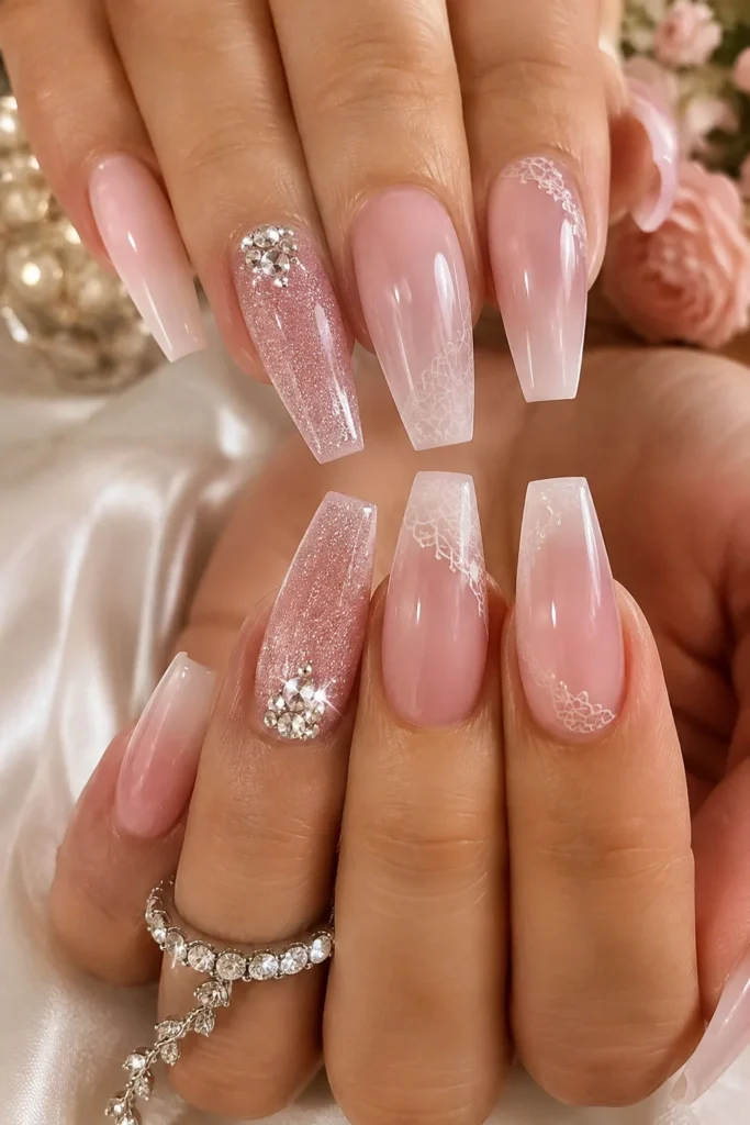 Pink glitter ombre graduation nails with rhinestone diamond accent details