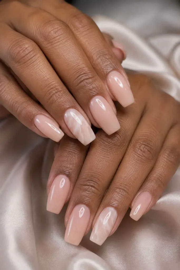 Glossy Bubble Bath nails with milky pink polish and white marble accent