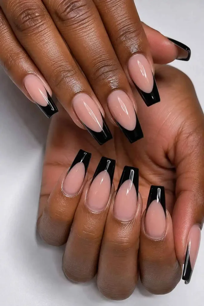 Glossy black French coffin nails with crisp dark tips