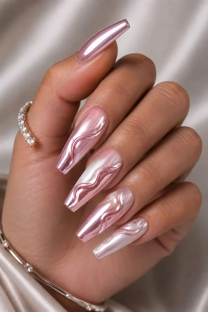 Light pink chrome coffin nails with raised 3D swirl nail art