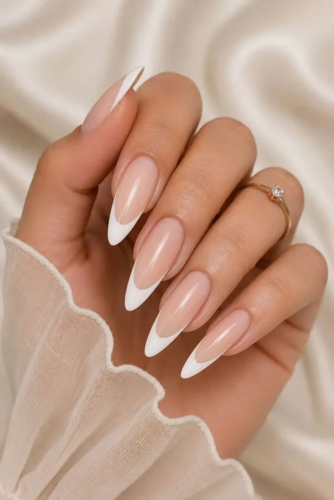 Long almond French tip nails with elegant glossy tips