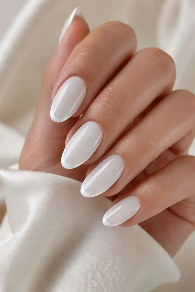 Milky white French tip nails with white-on-white tips