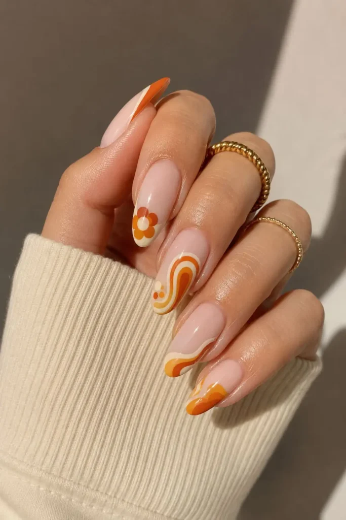 Retro French Bubble nails with 70s-inspired paisley swirl designs