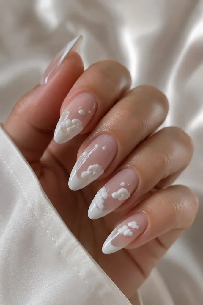 Textured white French nails with soft 3D nail art