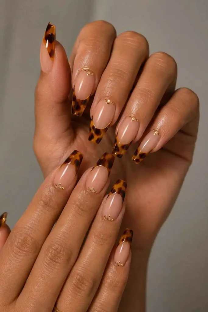 Tortoise French coffin nails with warm brown tips and gold accents