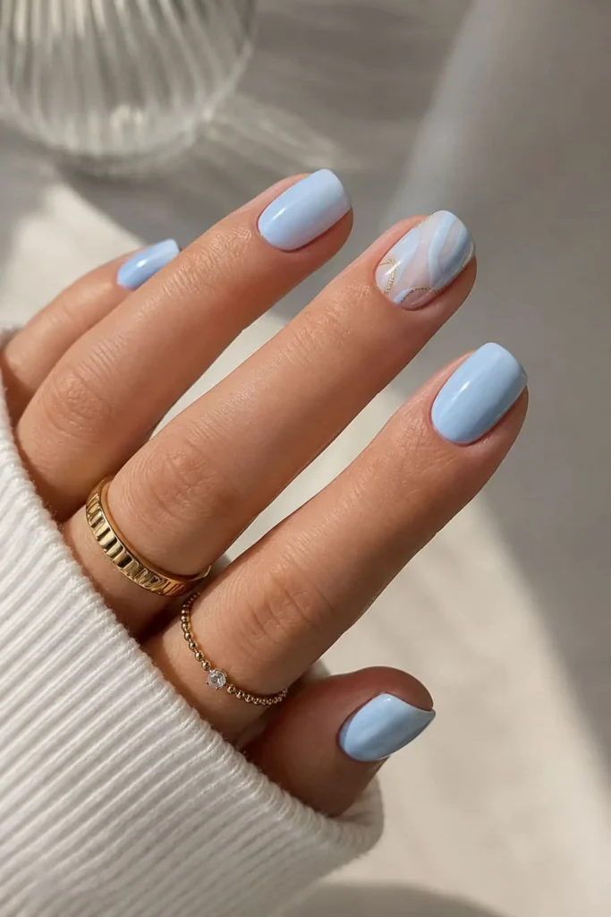 Soft blue wedding nails with delicate white bridal details