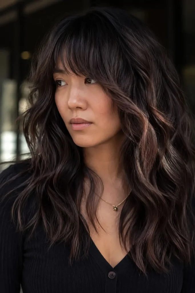 Classic shag hairstyle for long hair with choppy layers and dimensional highlights
