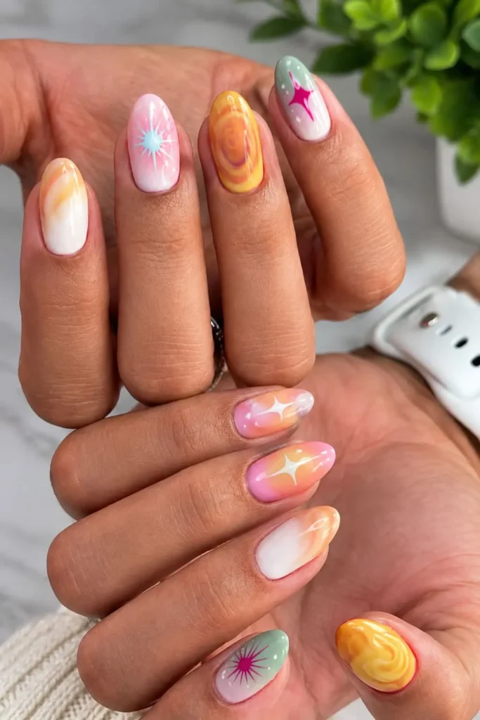 3D aura nails with colorful glowing gradients, sculpted droplets and gold chrome tips