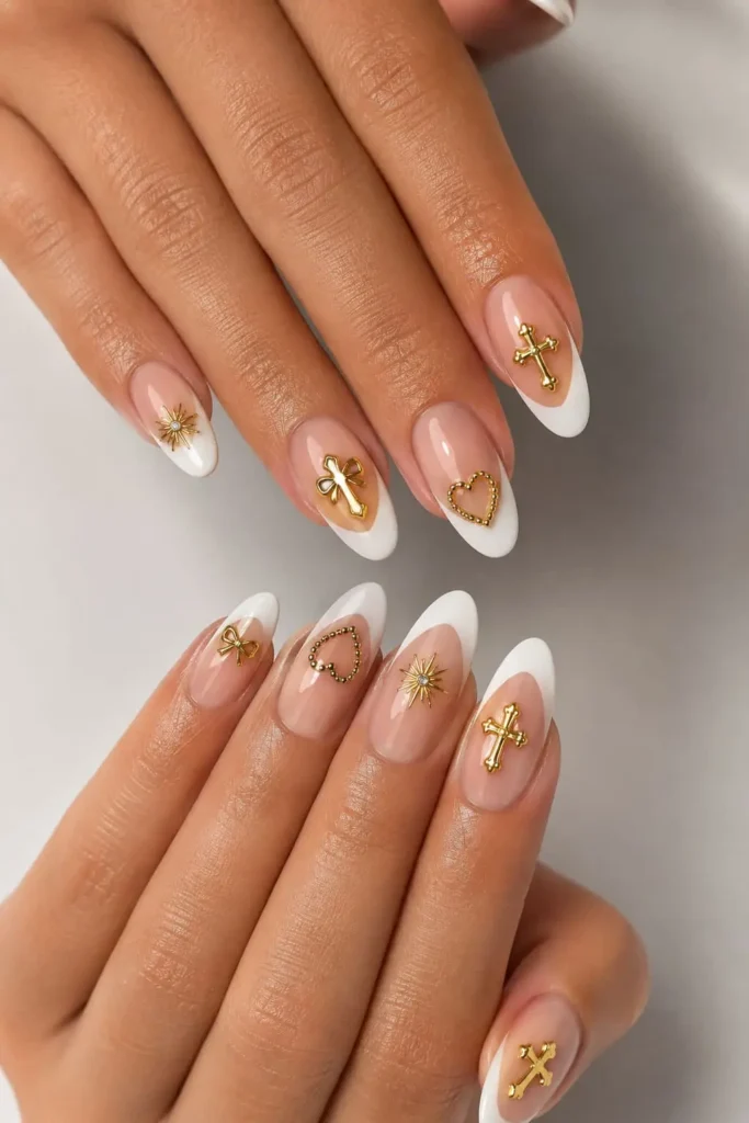 Bedazzled French tips decorated with a delicate gold nail charm