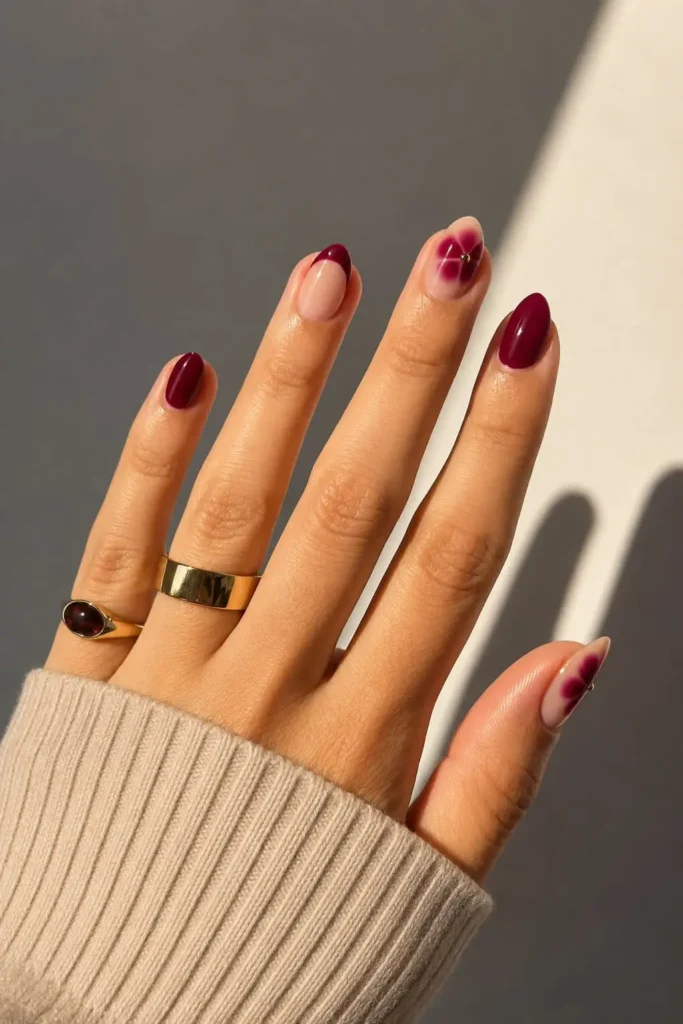 Burgundy blooming gel nails with soft flower-inspired nail art