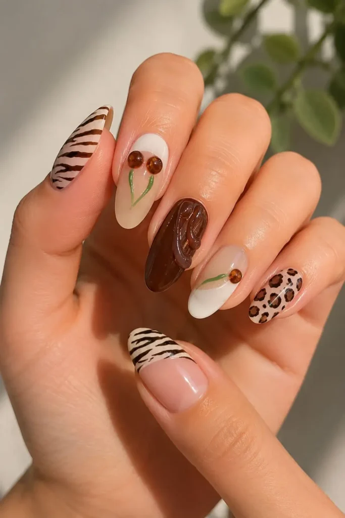 Burgundy cherry nails featuring dark red polish and delicate cherry nail art