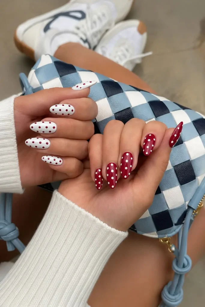 Burgundy polka dot nails with cream and dark red contrasting dots
