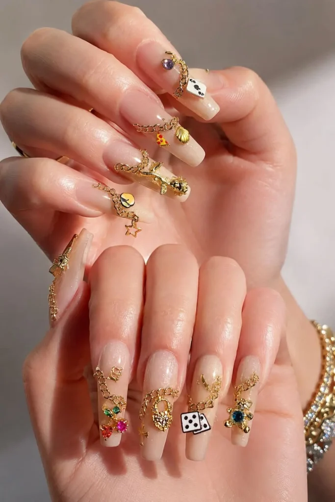 Charm necklace nails with delicate chain and decorative nail charms