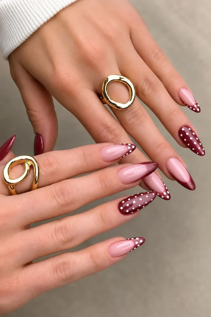 cherry red cat eye nails with white polka dots and topaz-inspired shade