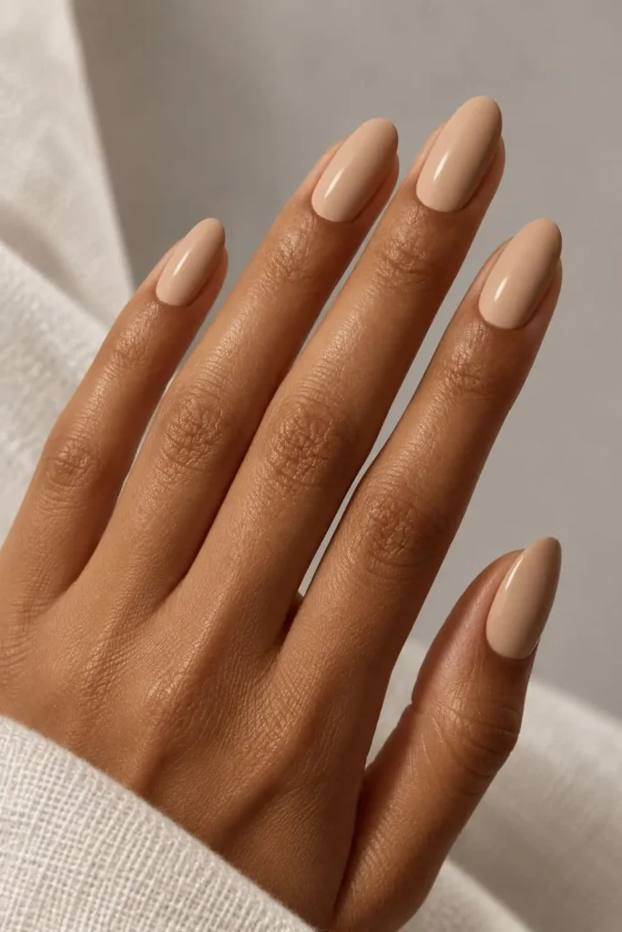 Creamy beige gel nails with a sleek high-shine finish