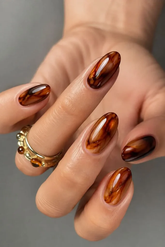 marble cat eye nails with coffee swirls and glassy magnetic shimmer