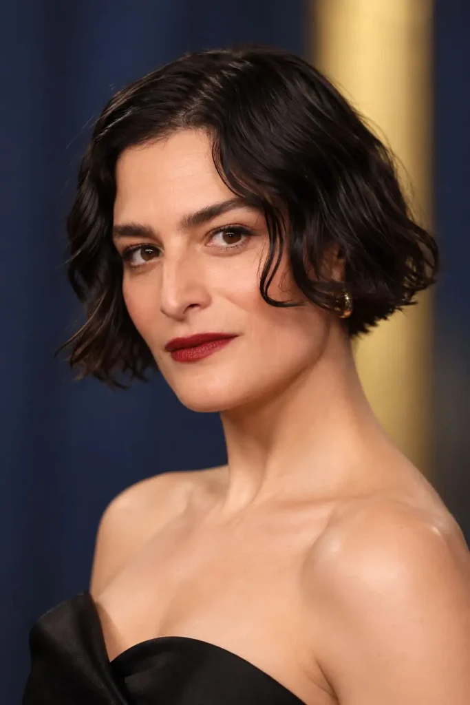 Micro bob haircut cut below the ears with soft waves and glossy inward-flipped ends