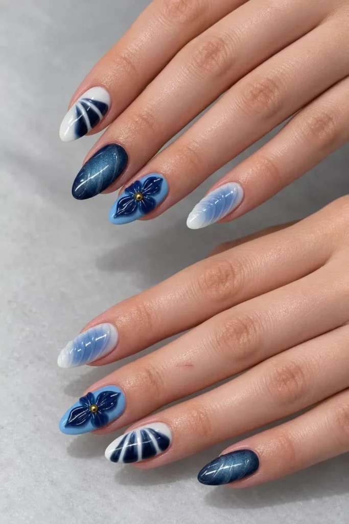 Midnight blue aura nails blending rich indigo into inky black with 3D floral details