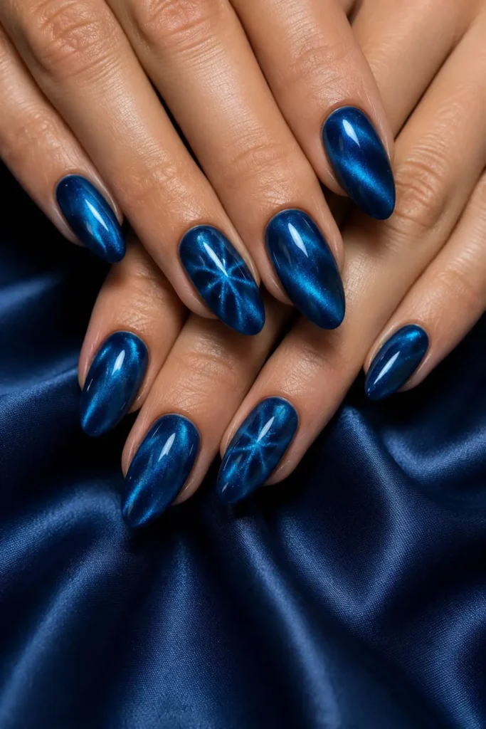 midnight blue cat eye nails with silver magnetic shimmer