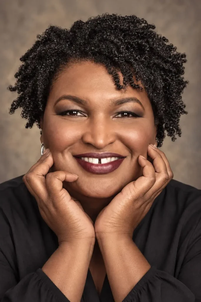Natural short coils with a side part for Black women over 50