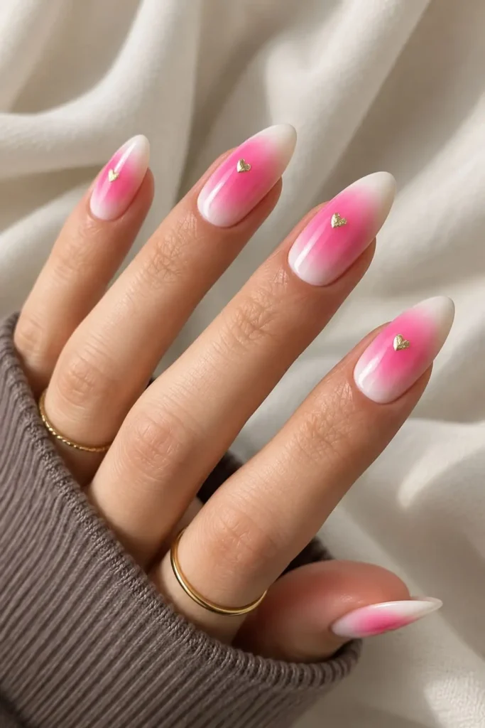 Pink and white aura nails with a crisp white base and soft glowing pink centers