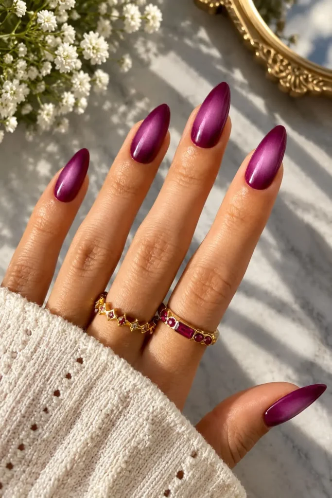 Purple aura nails with lavender and deep eggplant blended into a soft glowing gradient