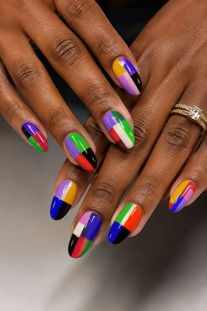 Short acrylic nails with crisp pastel and bold color block geometric designs