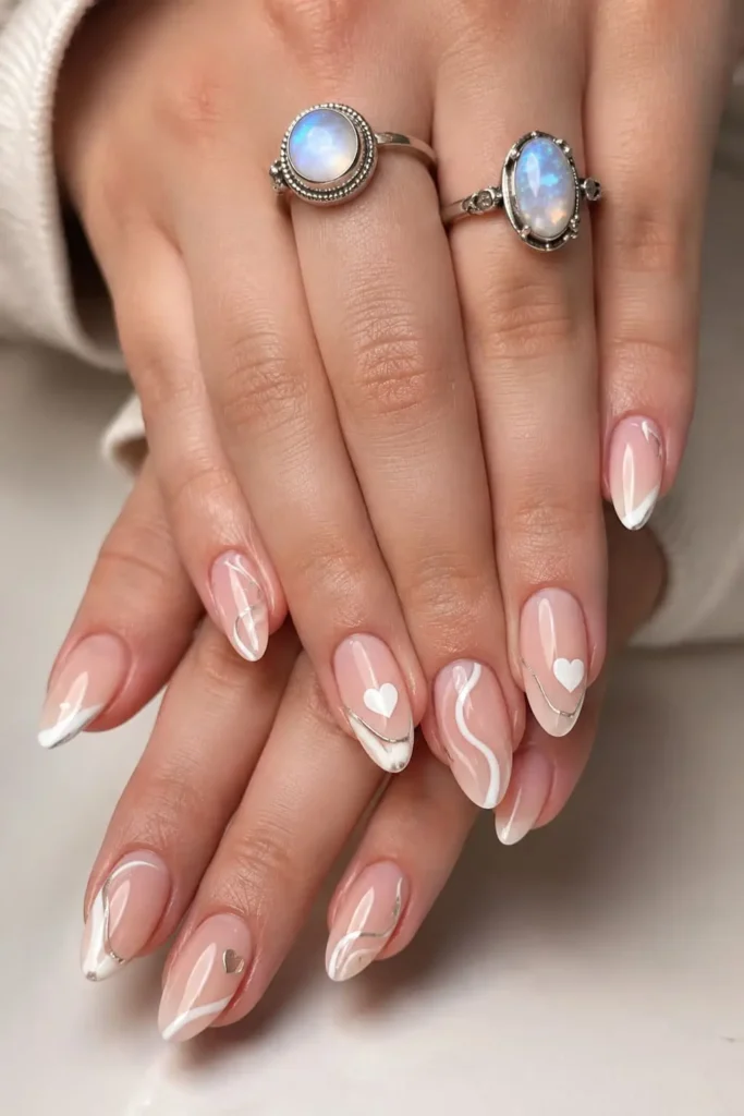 Short acrylic wave ripple nails with thin flowing white lines and pastel colors
