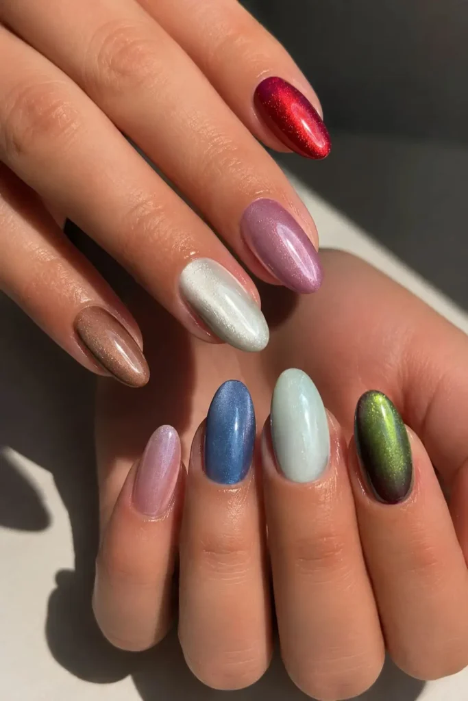 colorful skittle cat eye manicure with different magnetic nail shades