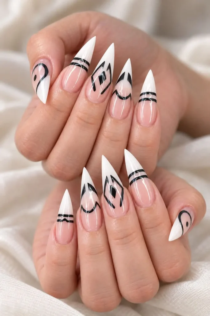Sukuna-inspired ombré French tip nails with blood-orange color and black facial markings