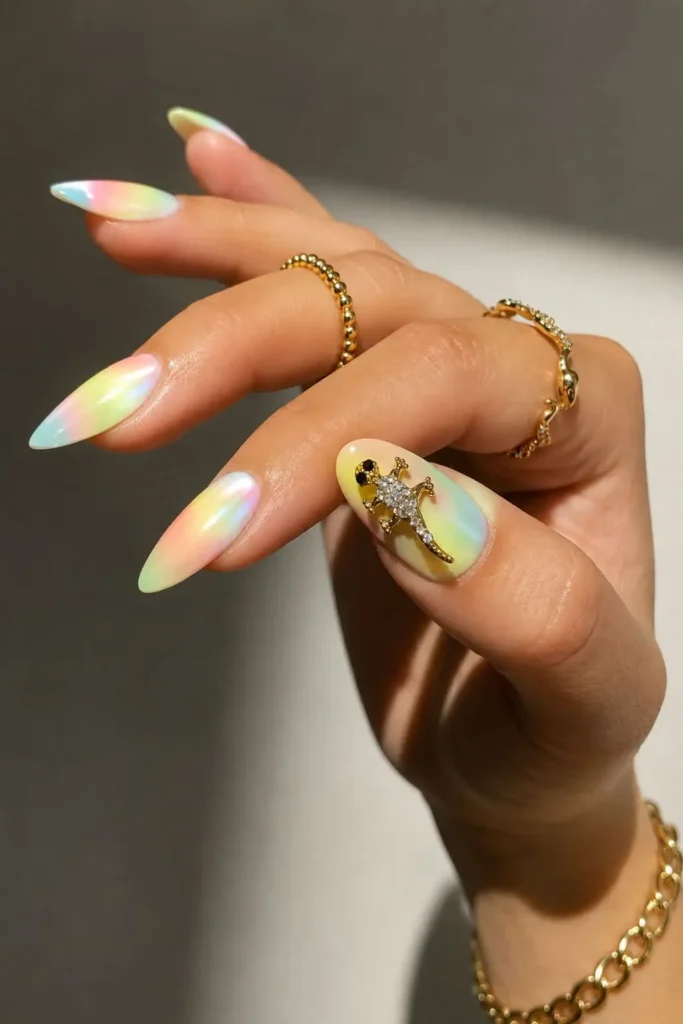 Tie dye charm nails with colorful swirls and a sparkling 3D accent