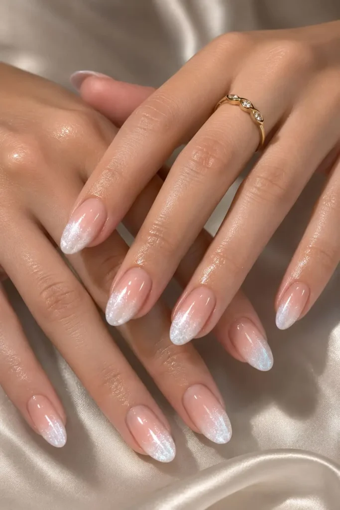 white ombre French tip cat eye nails with soft magnetic glow